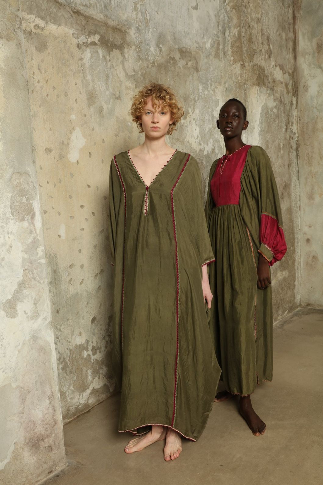 Model is wearing the Thea Olive Silk Dress by Supernaturae in soft olive-toned handwoven silk from Murshidabad, featuring a relaxed flowing silhouette and elegant open back. This sustainable ethical fashion dress is crafted using traditional weaving techniques and natural fibers, designed for everyday wear with a breathable, lightweight drape.