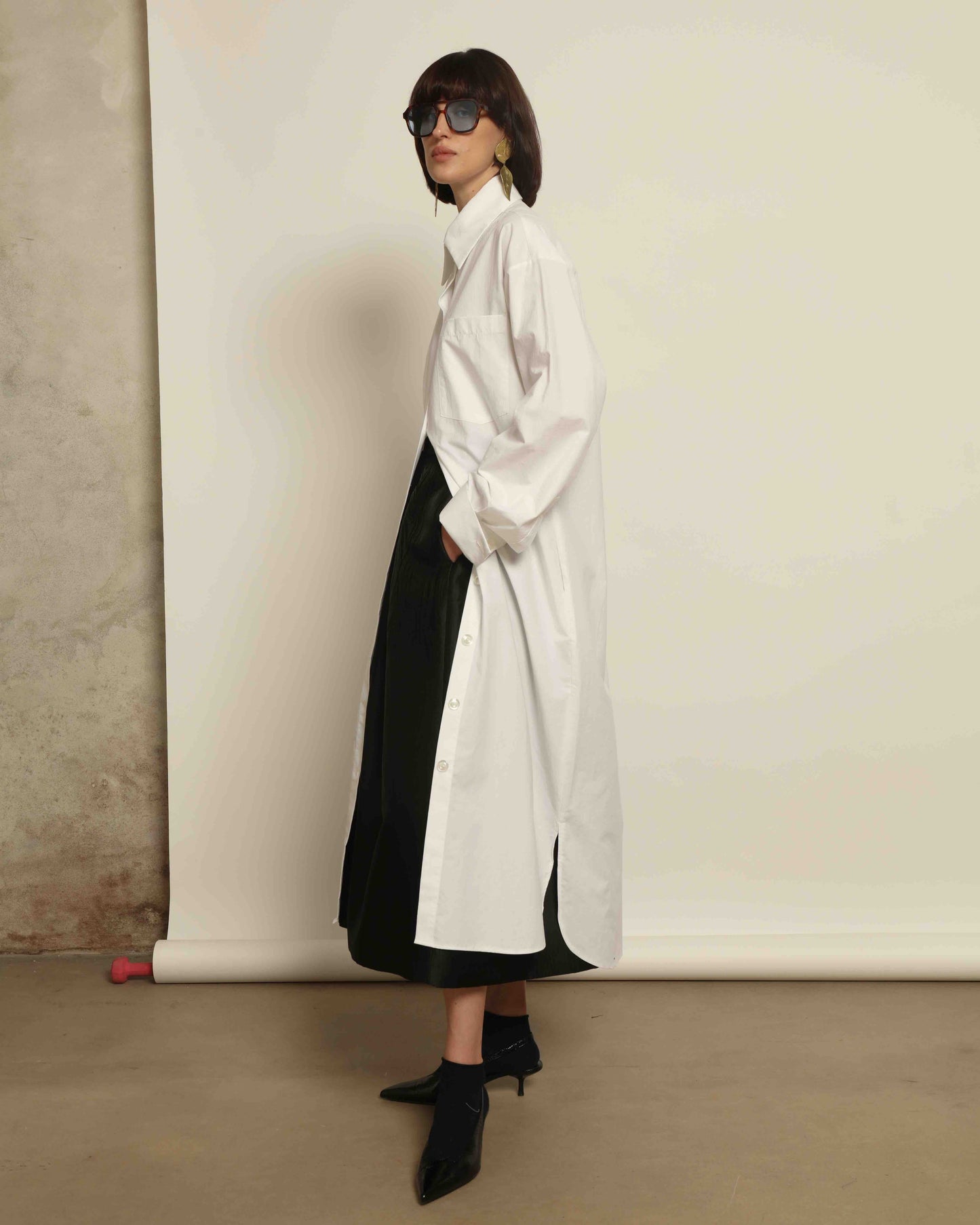 White Oscar Cotton Dress with asymmetric silk panel, crisp cotton fabric, sharp collar, and button-down front by House of Woven Stories.