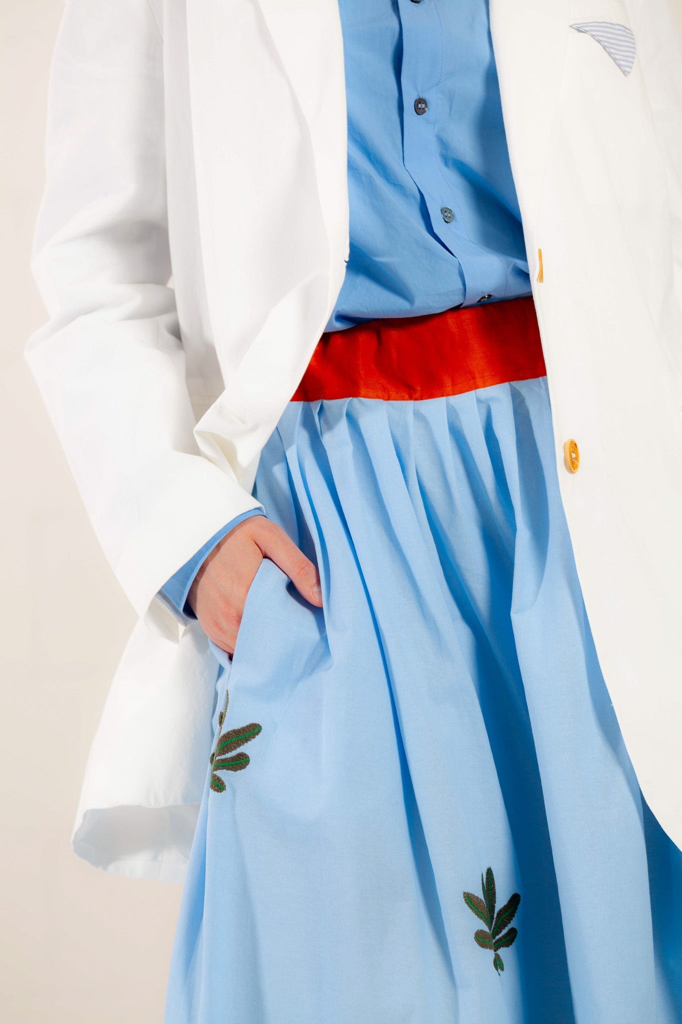 Model is wearing the Will Latte Cotton Blazer by Balia 8.22, featuring a relaxed silhouette, single-breasted front, and chic latte hue for timeless, versatile elegance. Part of House of Woven Stories selection.