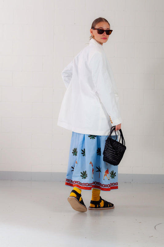 Model is wearing the Will Latte Cotton Blazer by Balia 8.22, featuring a relaxed silhouette, single-breasted front, and chic latte hue for timeless, versatile elegance. Part of House of Woven Stories selection.