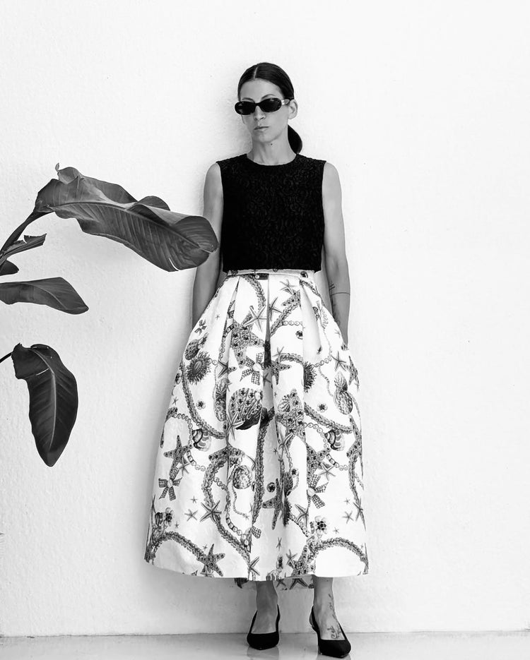 Designer wearing her own handcrafted Lunatica Milano skirt, made from high-quality Italian fabrics with a unique retro-inspired design.
