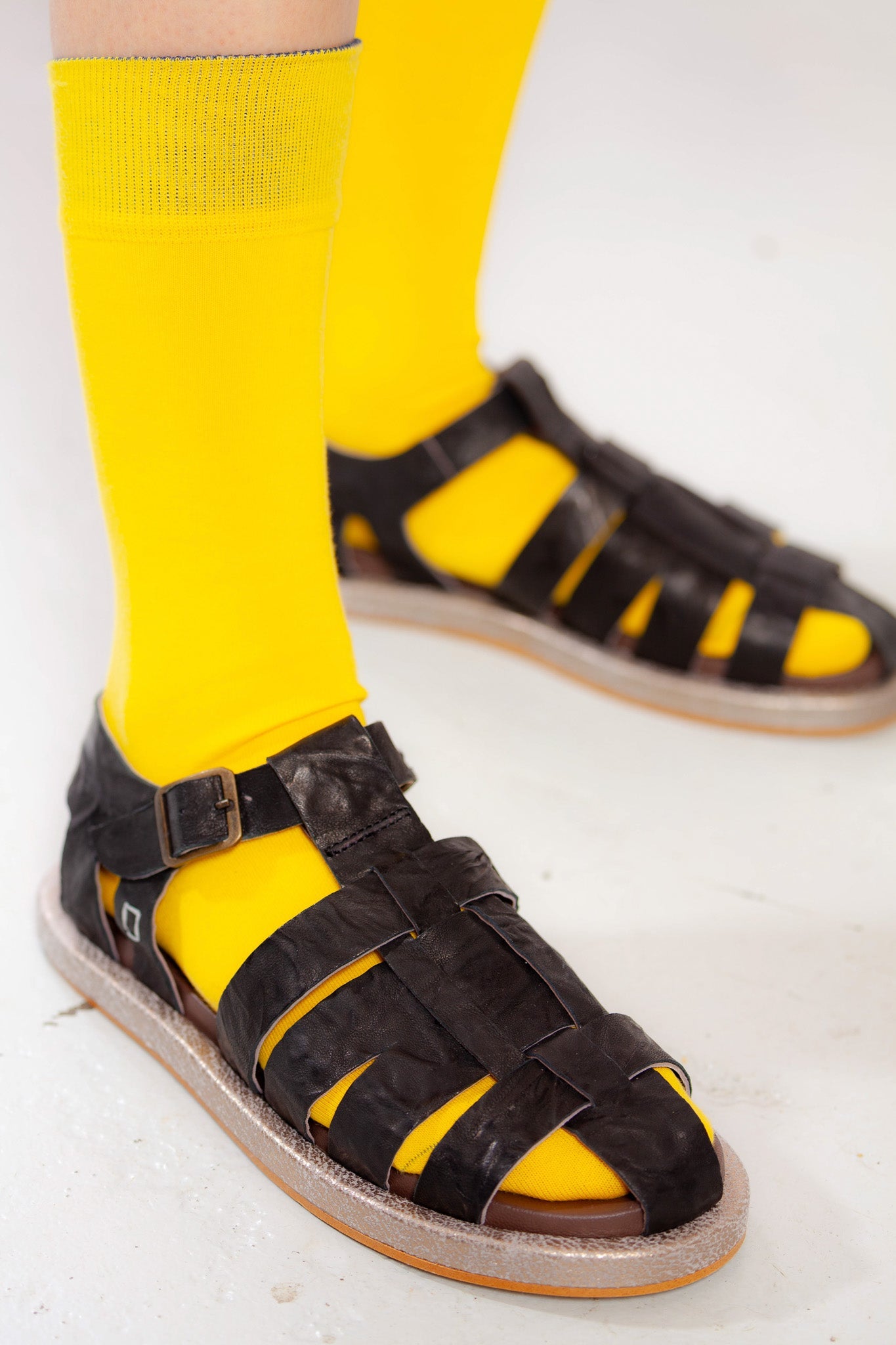 Adan Black Sandals by Collection PRIVĒE in ovine leather with a sleek silhouette and lightweight microsolite sole. Available at House of Woven Stories.