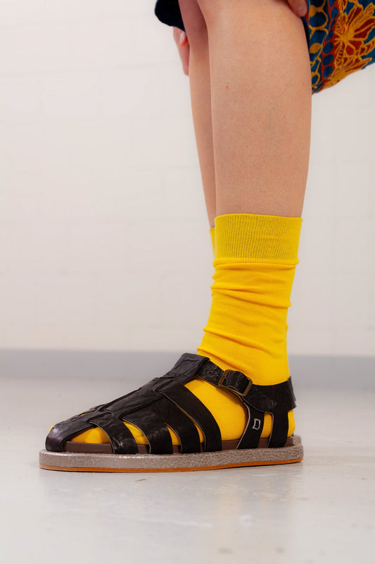 Adan Black Sandals by Collection PRIVĒE in ovine leather with a sleek silhouette and lightweight microsolite sole. Available at House of Woven Stories.