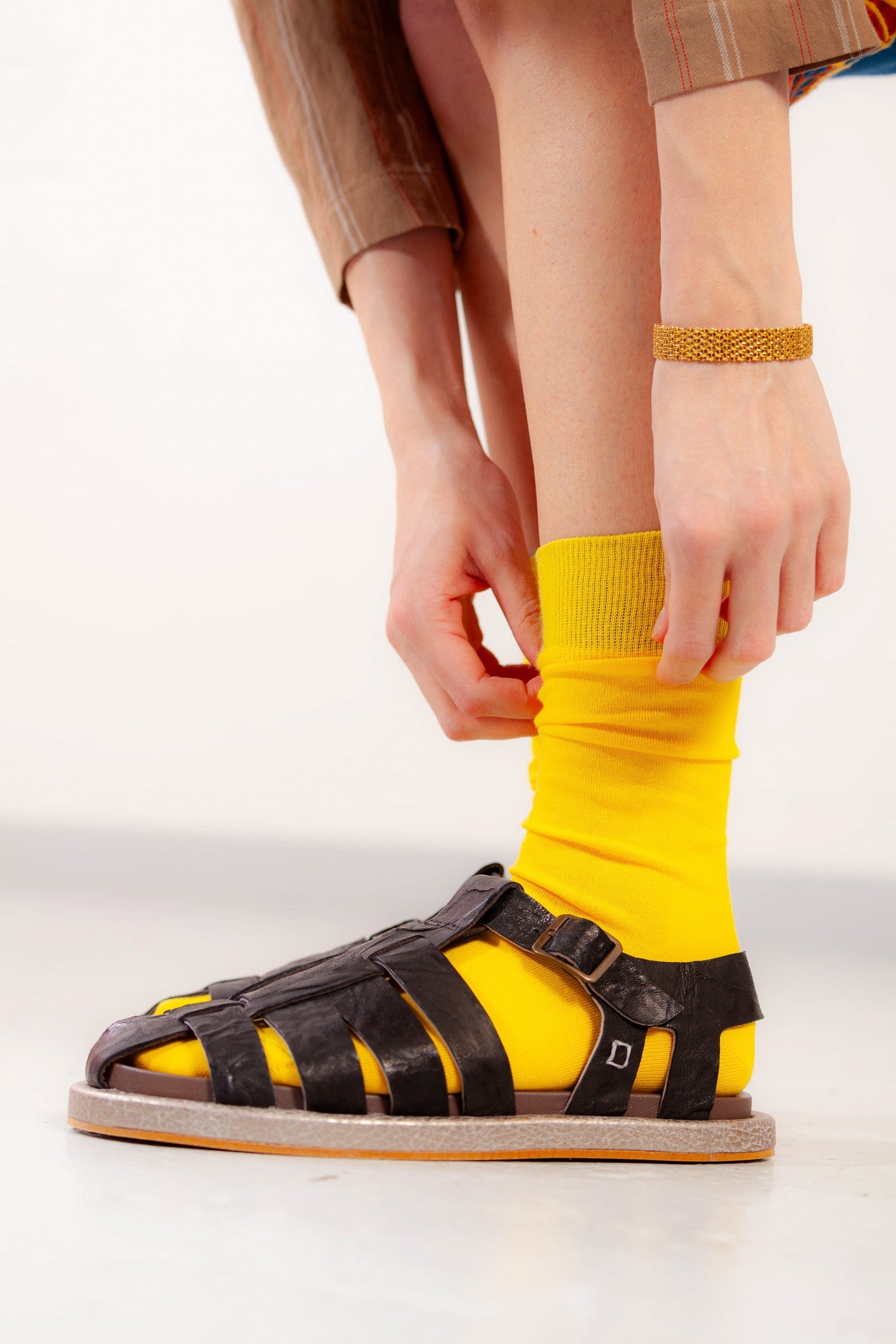 Adan Black Sandals by Collection PRIVĒE in ovine leather with a sleek silhouette and lightweight microsolite sole. Available at House of Woven Stories.