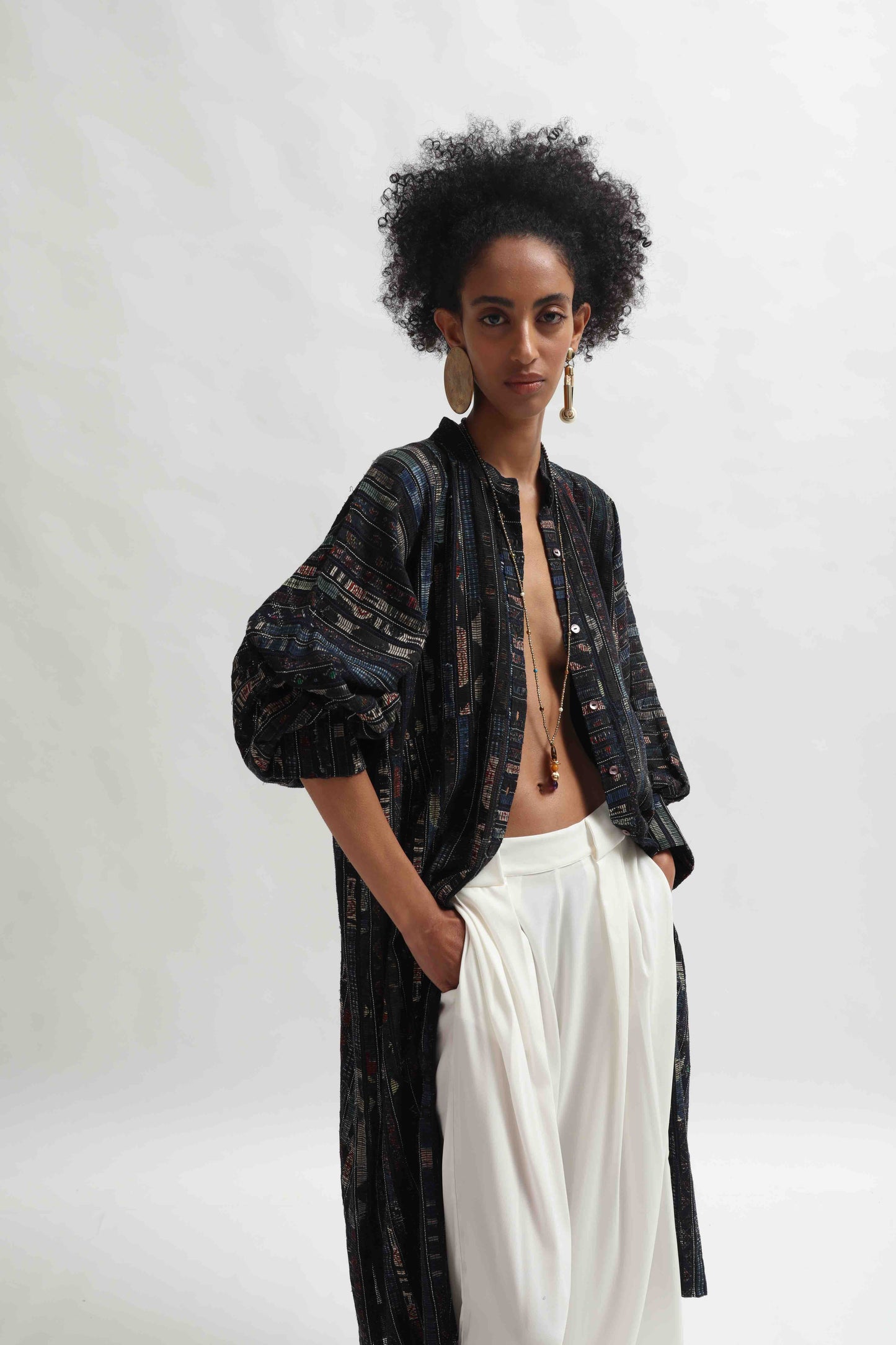 Lightweight Ajrakh Balloon Long Jacket handcrafted by Paiwand in India. Made from upcycled textile scraps with a unique leno weave and traditional handblock prints. Sustainable, ethical fashion blending heritage and innovation.