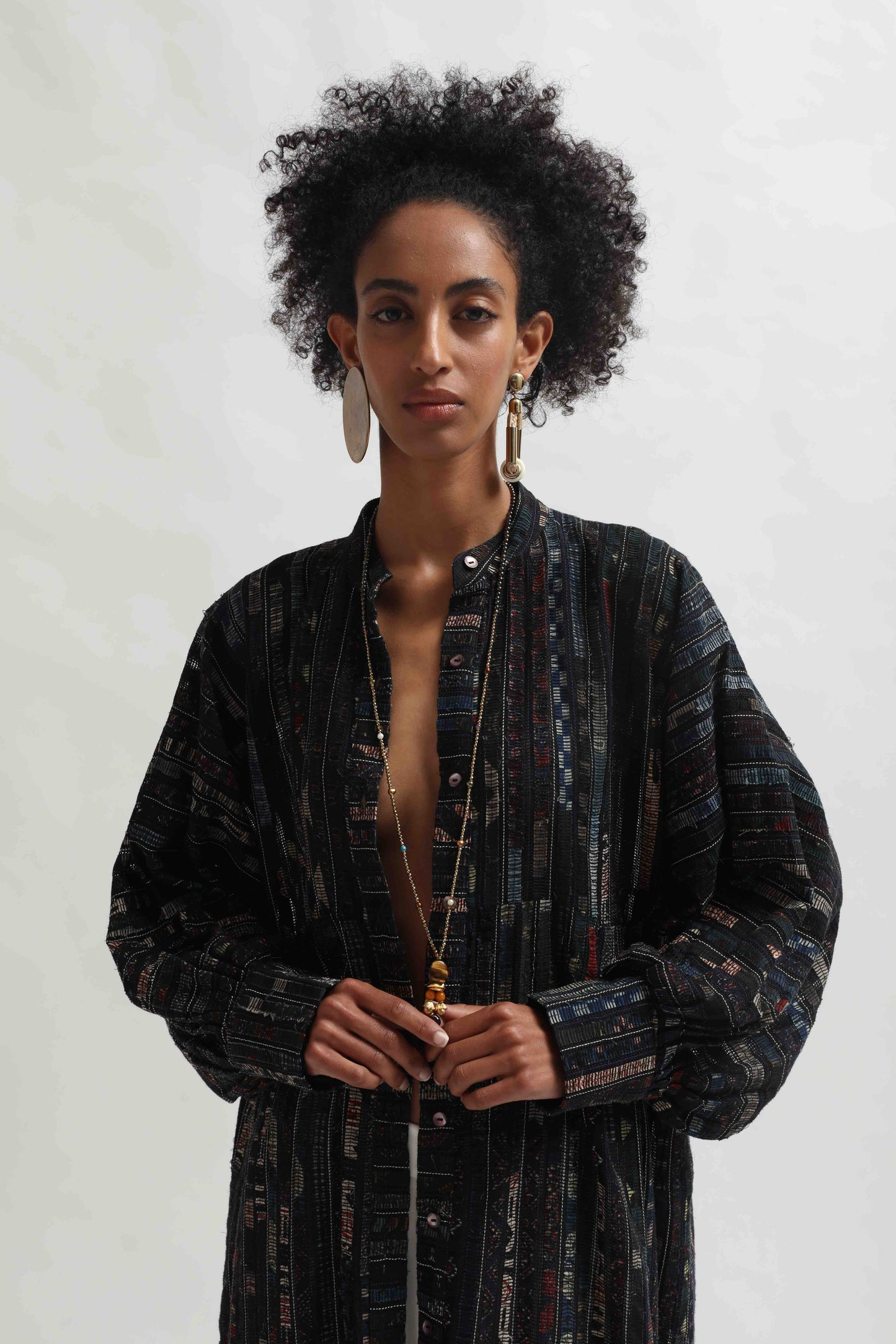 Lightweight Ajrakh Balloon Long Jacket handcrafted by Paiwand in India. Made from upcycled textile scraps with a unique leno weave and traditional handblock prints. Sustainable, ethical fashion blending heritage and innovation.
