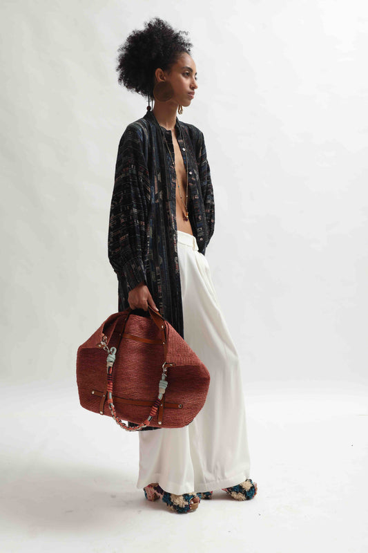Lightweight Ajrakh Balloon Long Jacket handcrafted by Paiwand in India. Made from upcycled textile scraps with a unique leno weave and traditional handblock prints. Sustainable, ethical fashion blending heritage and innovation.