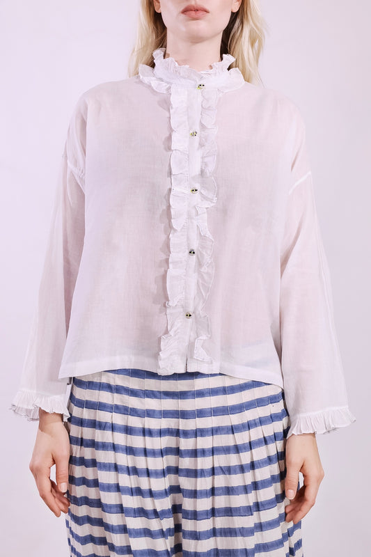 White pure cotton shirt by Injiri with cobalt ruffle stitching and yellow buttons, handmade and sustainable. Available at House of Woven Stories.