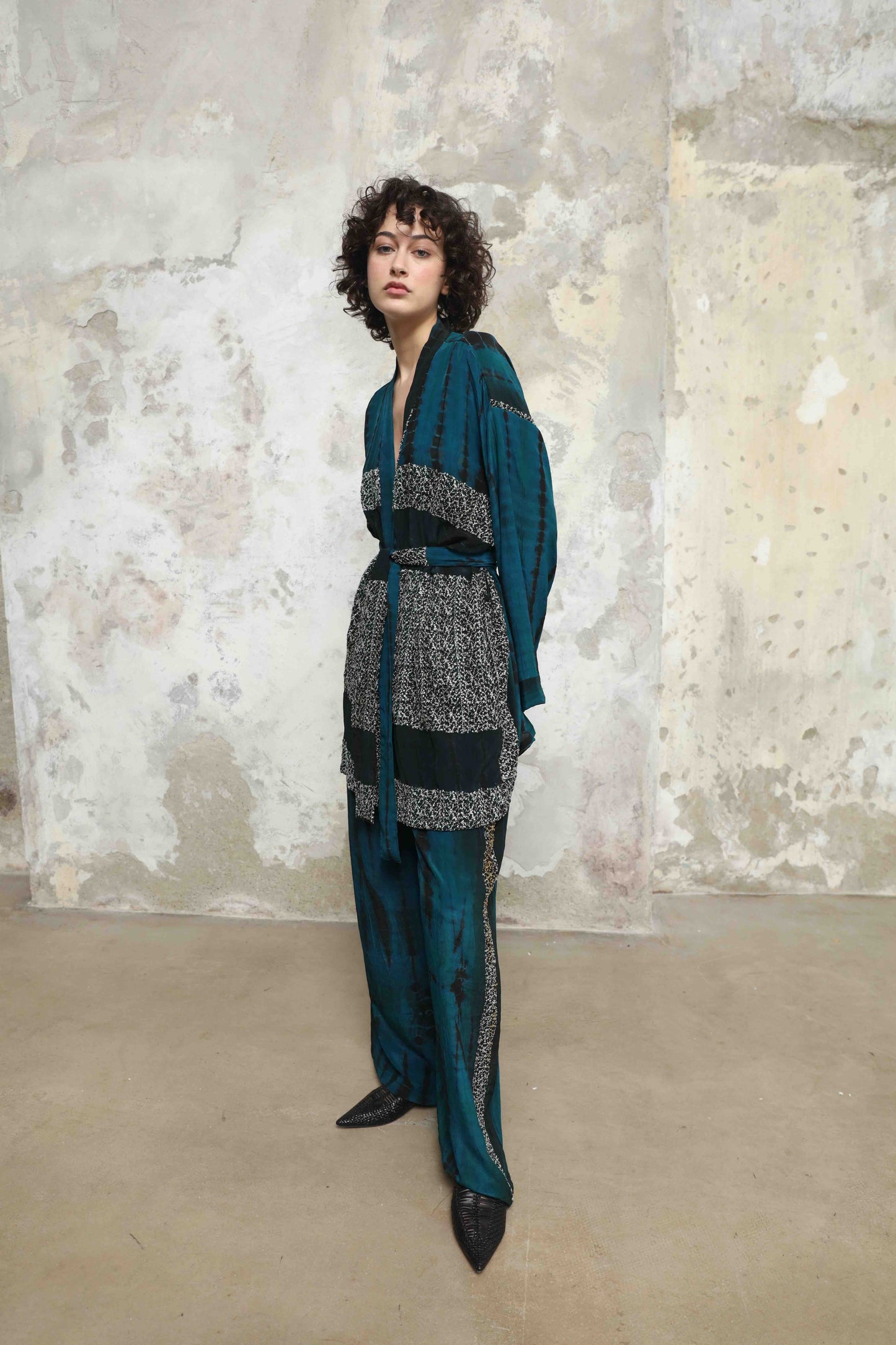 One-of-a-kind kimono suit made from upcycled antique saris, hand-dyed in India with the Shibori technique. Limited-edition, sustainable luxury by House of Woven Stories. Available in multiple colors.