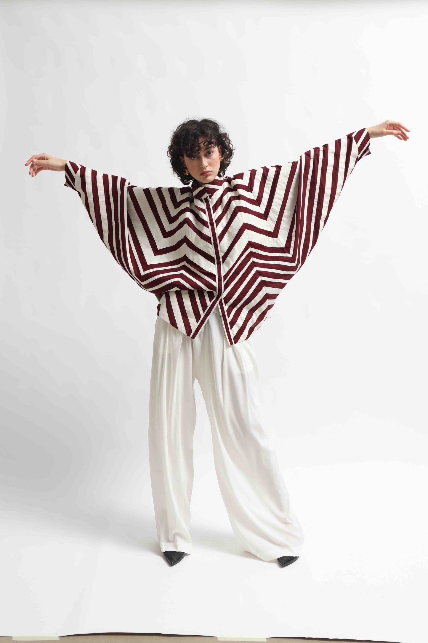Ka-Sha Bat Shirt: hand-dyed cotton, reversible pattern, appliqué details. Versatile, sustainable artisan fashion from House of Woven Stories.