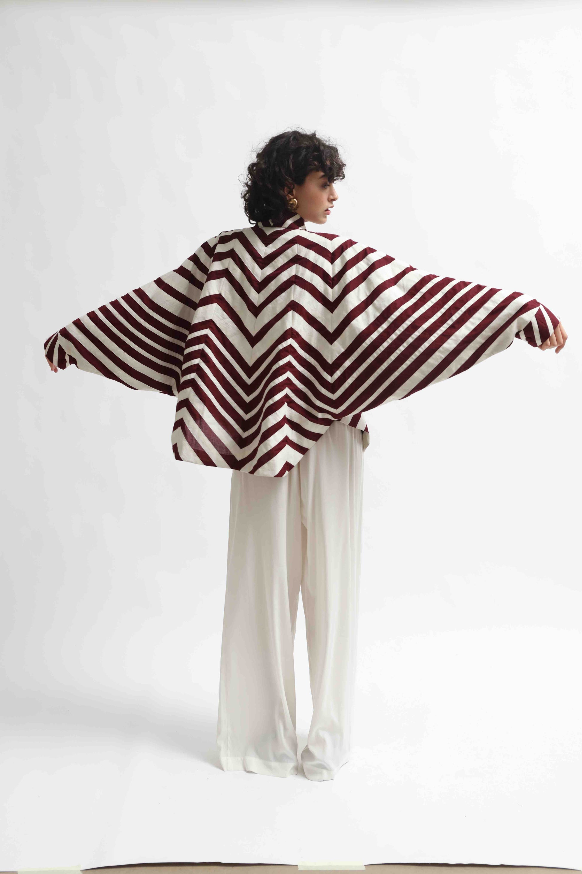 Ka-Sha Bat Shirt: hand-dyed cotton, reversible pattern, appliqué details. Versatile, sustainable artisan fashion from House of Woven Stories.