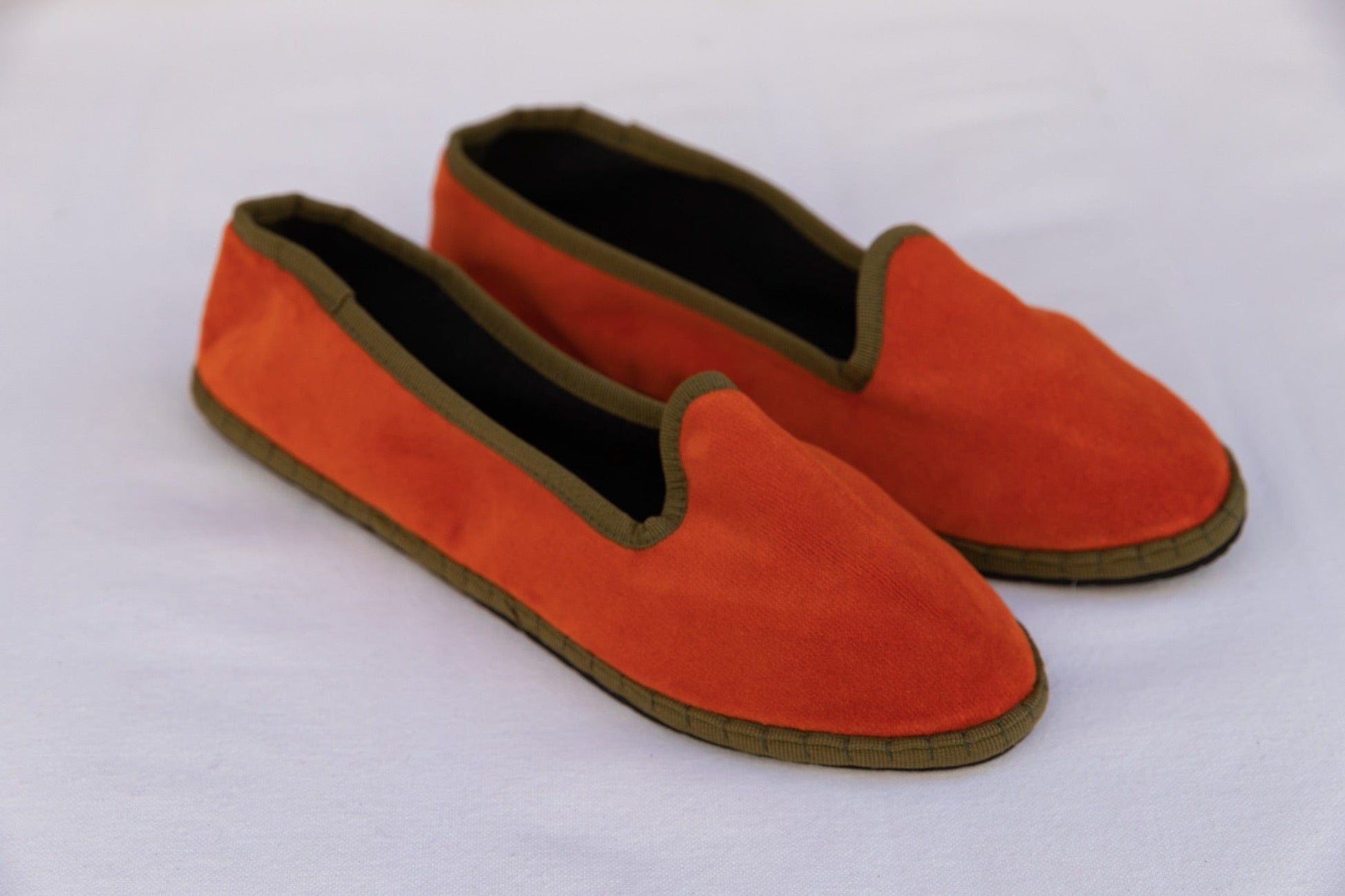 Handmade in Venice from upcycled luxury fabrics with recycled rubber soles. Brick and Olive Venetian Slippers by Teod’amar are timeless and sustainable. Part of House of Woven Stories section. 