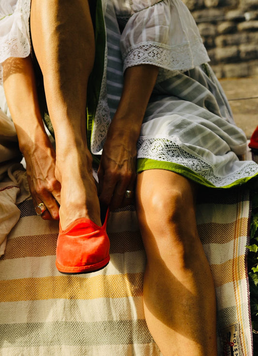 Handmade in Venice from upcycled luxury fabrics with recycled rubber soles. Bright Orange Venetian Slippers by Teod’amar are timeless and sustainable. Part of House of Woven Stories section. 