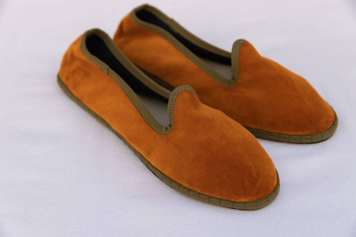 Handmade in Venice from upcycled luxury fabrics with recycled rubber soles. Bronze and Olive Venetian Slippers by Teod’amar are timeless and sustainable. Part of House of Woven Stories section. 