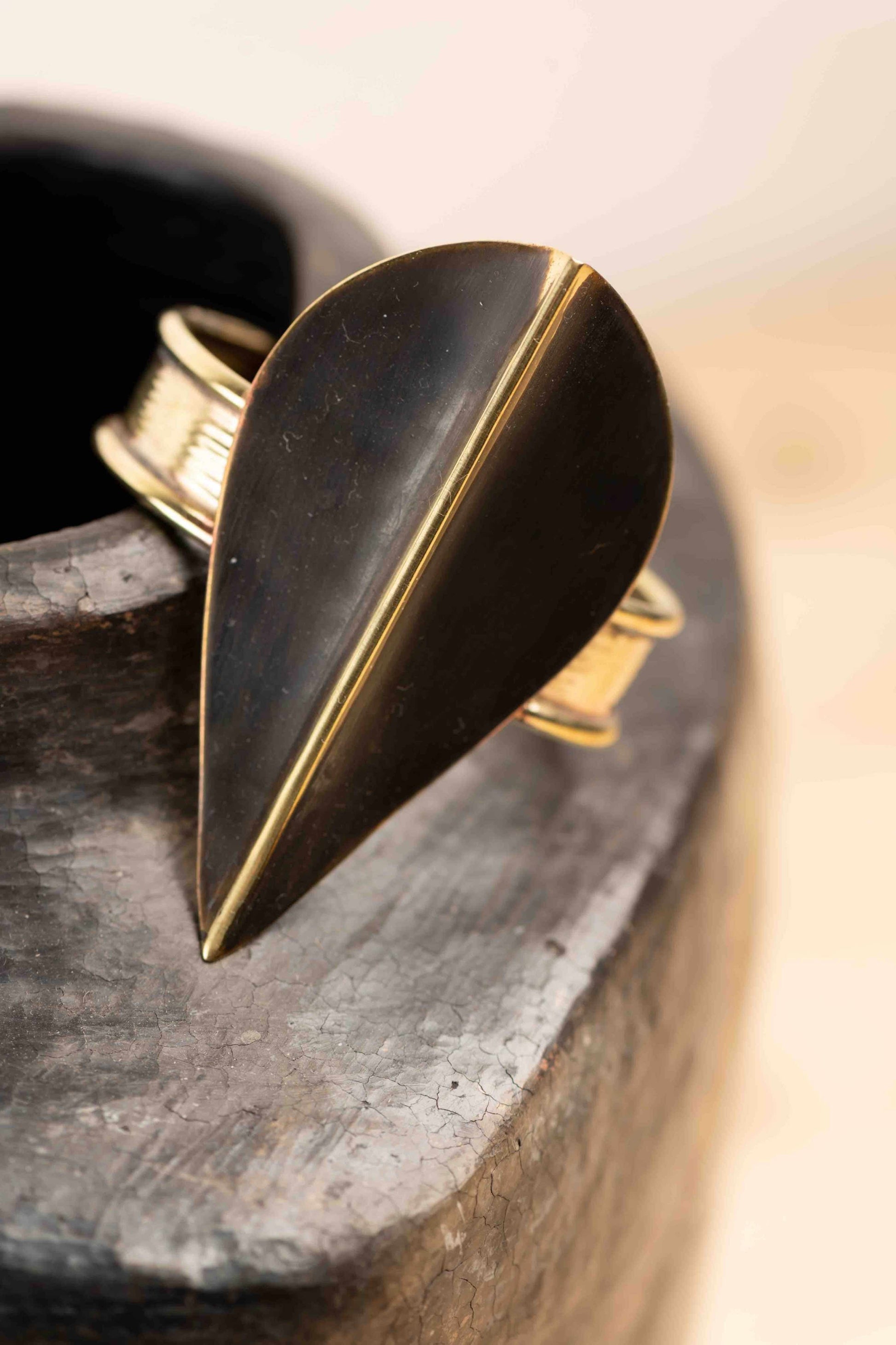 Bronze Patinè Noir hammered bronze slip-on bracelet by Stéphane Szendy, showcasing artisanal craftsmanship and timeless design. Part of HouseofWovenStories selection.