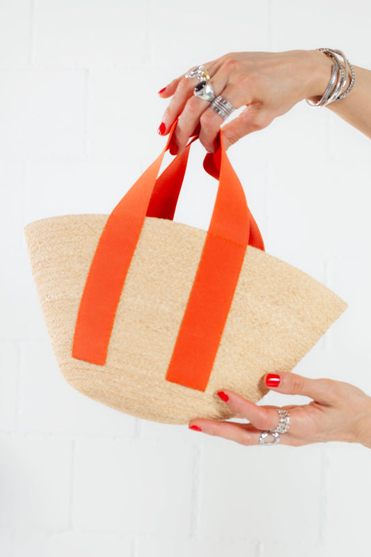 Carrot Mini Market raffia bag by Lola Hats with elastic handles and stitched raffia tape design. Available at House of Woven Stories.