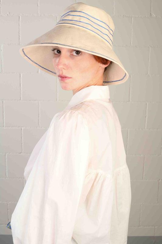 Cobalt blue stitched canvas bucket hat by Lola Hats, handmade from sail canvas with a medium brim and flexible design. Available at House of Woven Stories.