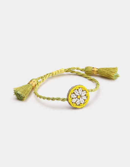 Hand-beaded Lemon Slice bracelet with handmade tassels from Olivia Dar’s Fruit Punch collection, crafted in New Delhi with sustainable materials.