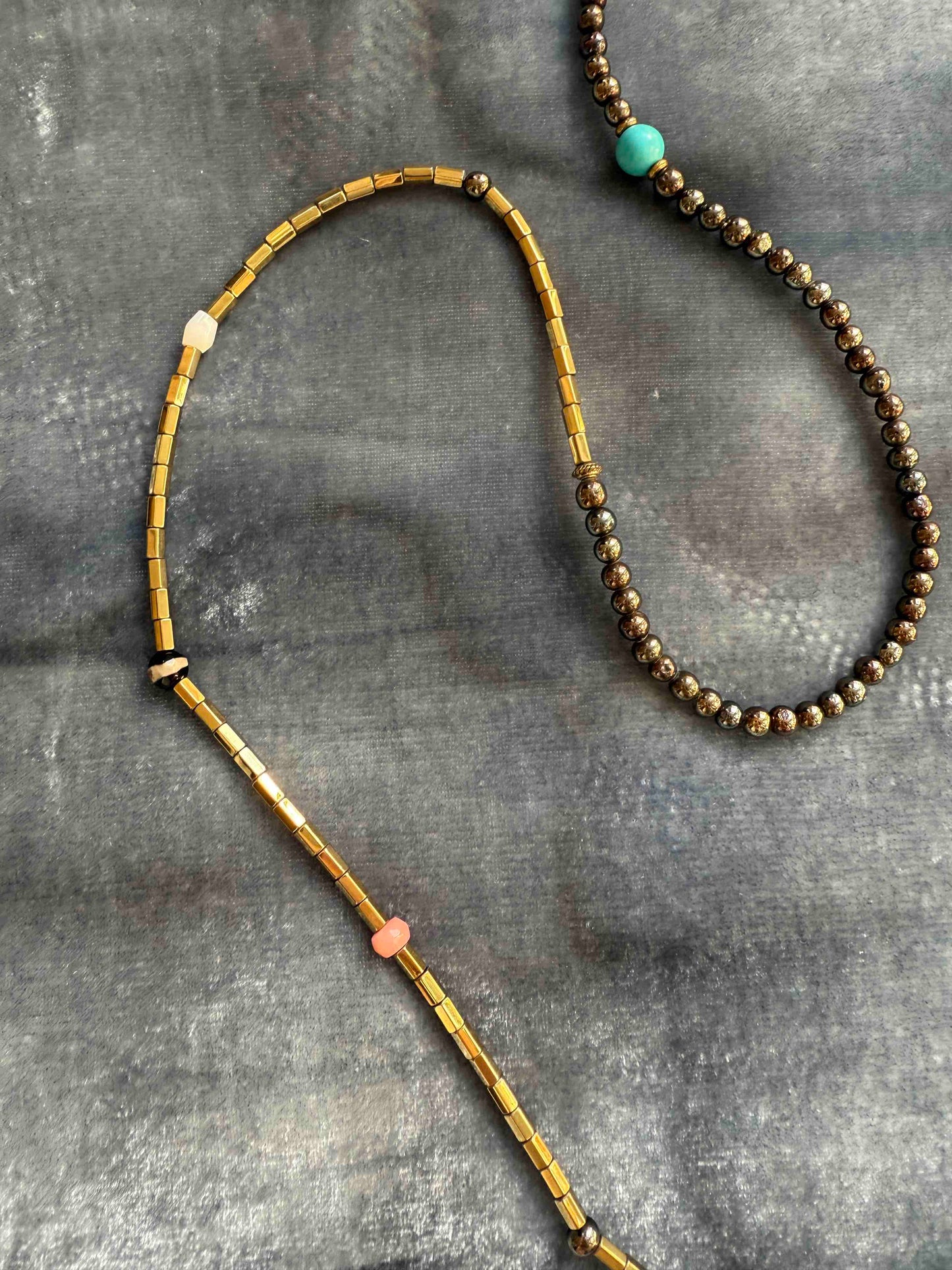 Striking handcrafted choker necklace with pyrite, pink bamboo coral, turquoise, bone inlay, and brass details. Made in Italy by Ilaria Fiorentini Jewellery. Part of the House of Woven Stories selection.