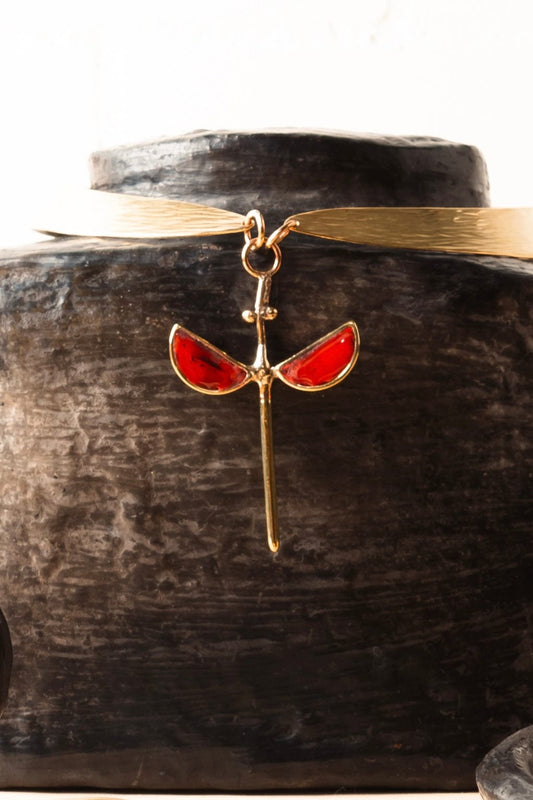 Coral hammered bronze necklace with symmetrical enamel pendant by Stéphane Szendy, handcrafted and sculptural design. Part of House of Woven Stories selection.