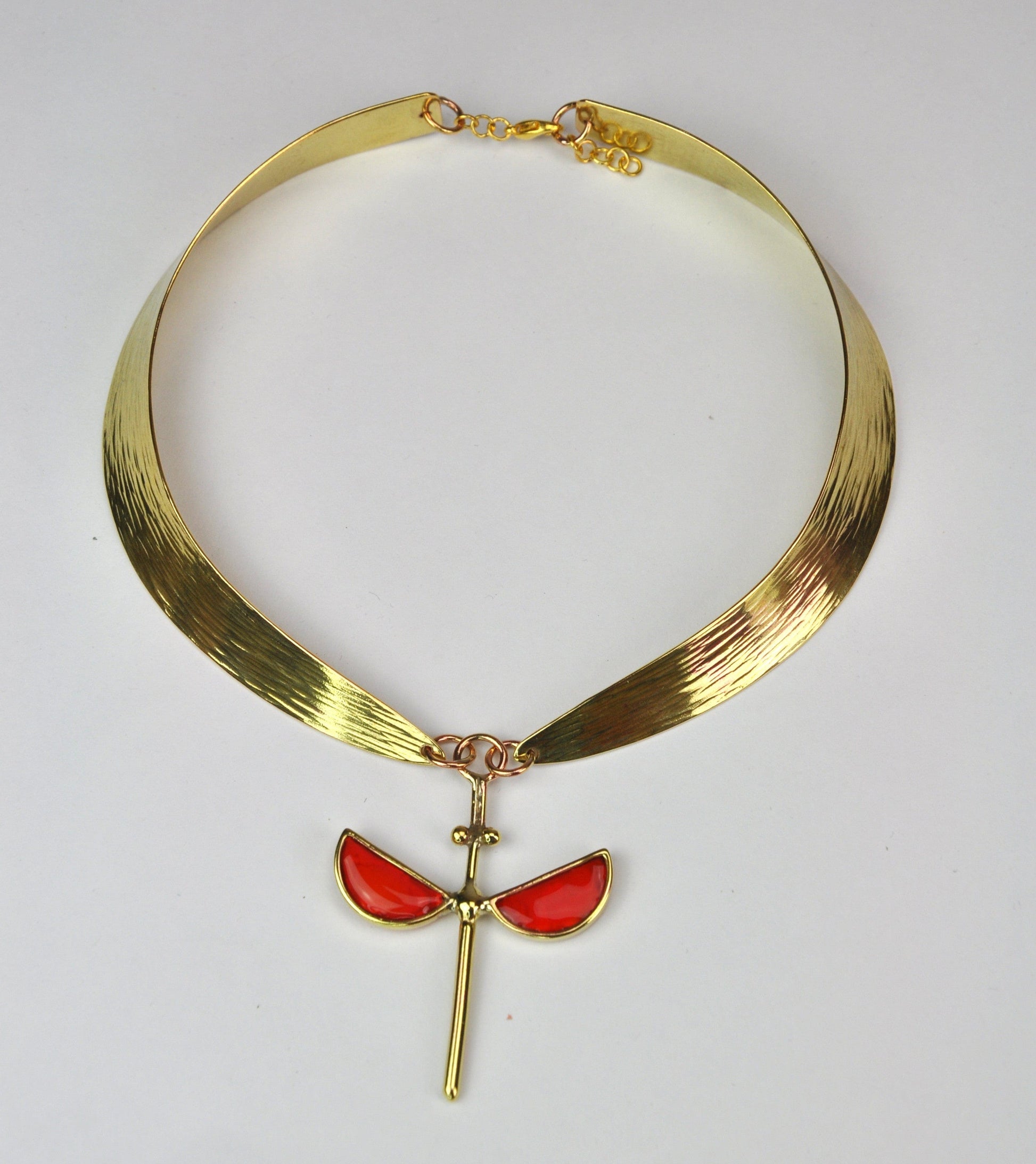 Coral hammered bronze necklace with symmetrical enamel pendant by Stéphane Szendy, handcrafted and sculptural design. Part of House of Woven Stories selection.