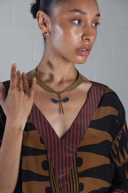 Royal Blue Hammered Bronze Collier necklace by Stéphane Szendy featuring symmetrical royal blue enamel shapes on a hammered bronze pendant. Part of House of Woven Stories selection.