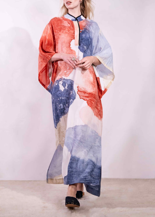Model wearing a lightweight, hand-painted cotton tunic by Agave Textiles, featuring a flowing one-size fit. Made in Argentina, part of the House of Woven Stories selection.