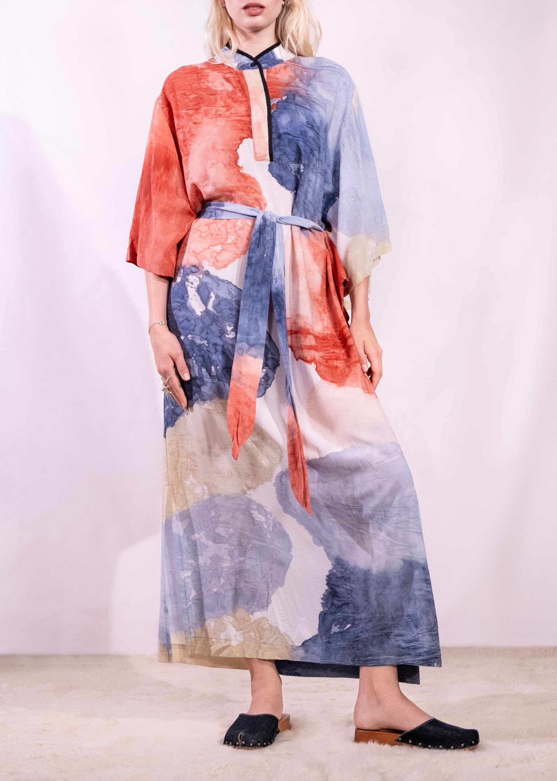 Model wearing a lightweight, hand-painted cotton tunic by Agave Textiles, featuring a flowing one-size fit. Made in Argentina, part of the House of Woven Stories selection.