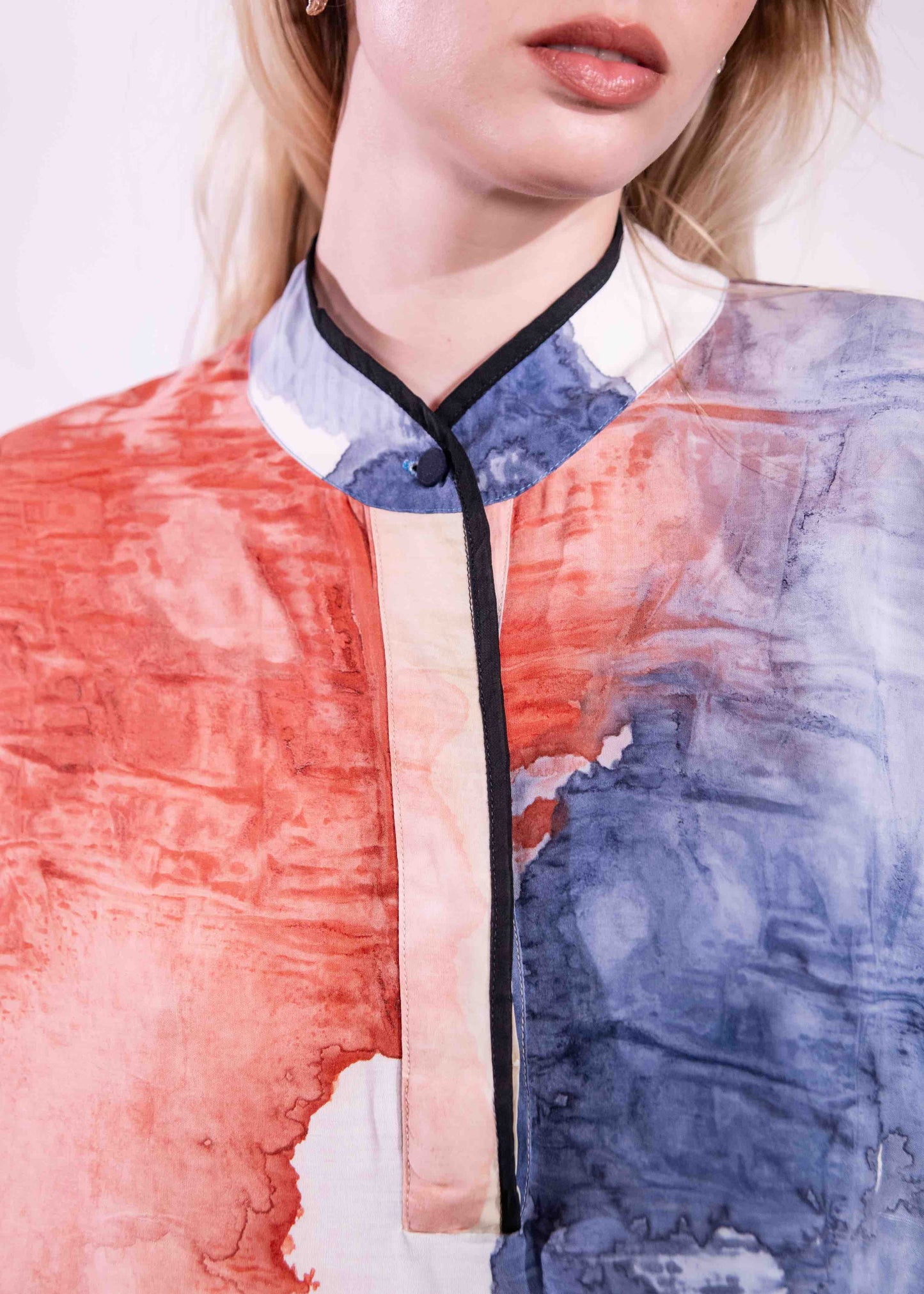 Model wearing a lightweight, hand-painted cotton tunic by Agave Textiles, featuring a flowing one-size fit. Made in Argentina, part of the House of Woven Stories selection.