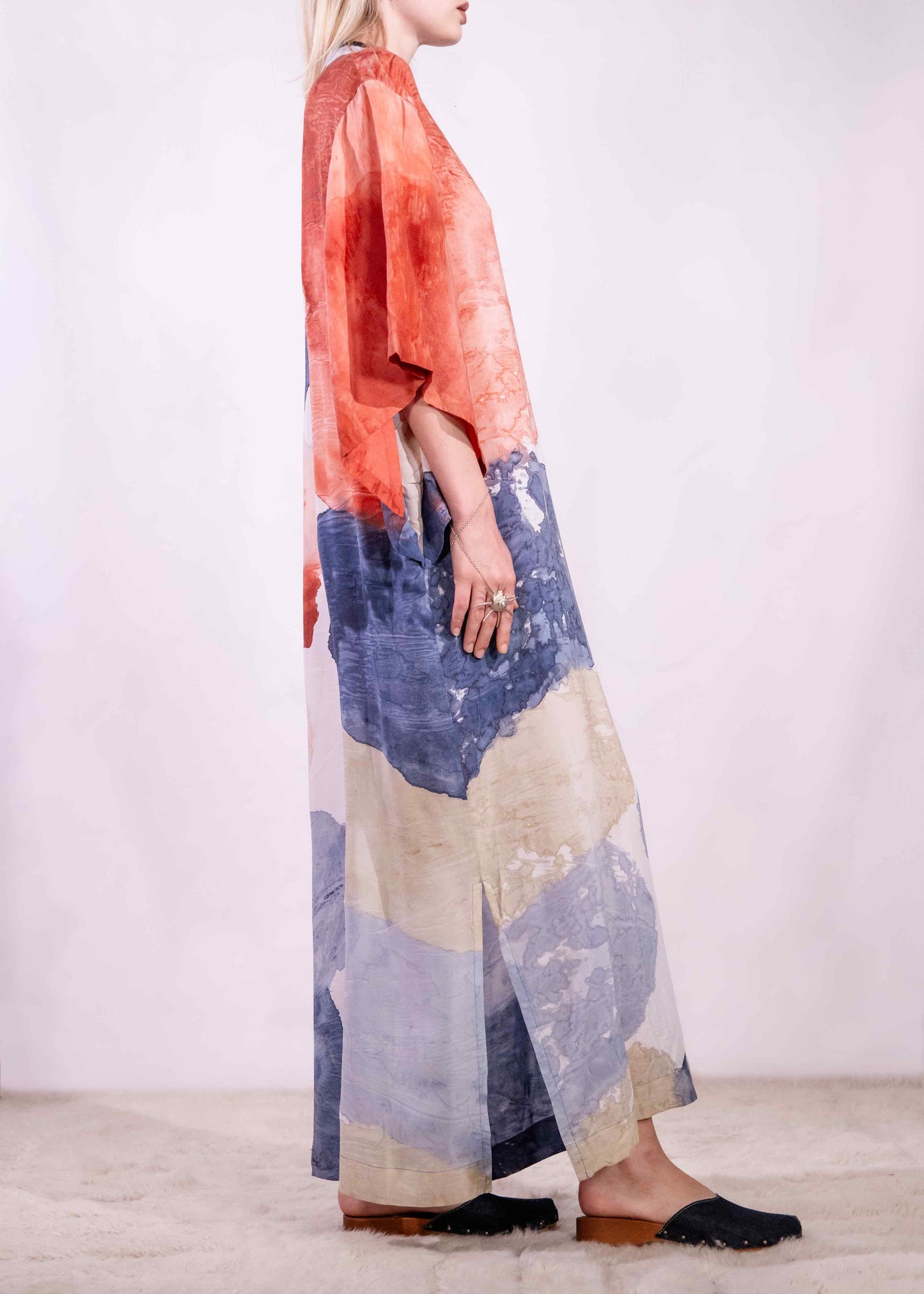 Model wearing a lightweight, hand-painted cotton tunic by Agave Textiles, featuring a flowing one-size fit. Made in Argentina, part of the House of Woven Stories selection.