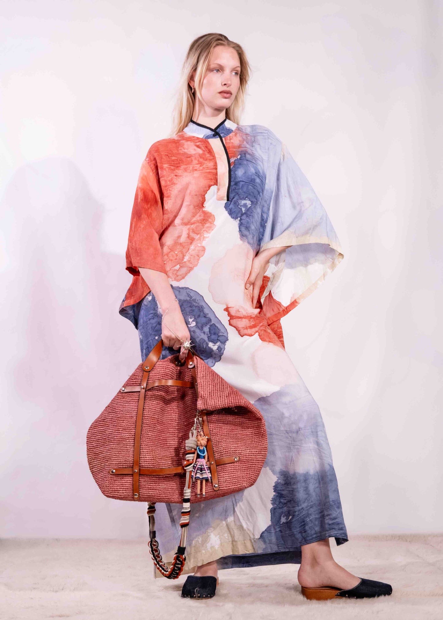 Model wearing a lightweight, hand-painted cotton tunic by Agave Textiles, featuring a flowing one-size fit. Made in Argentina, part of the House of Woven Stories selection.