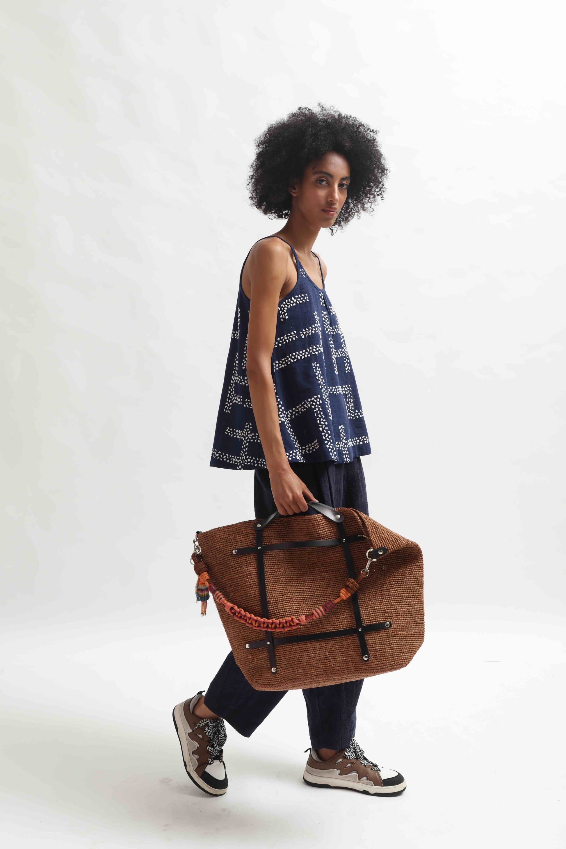 Indigo embroidered top by Paiwand made from organic indigo-dyed cotton with upcycled embroidery, ethically handcrafted in India.