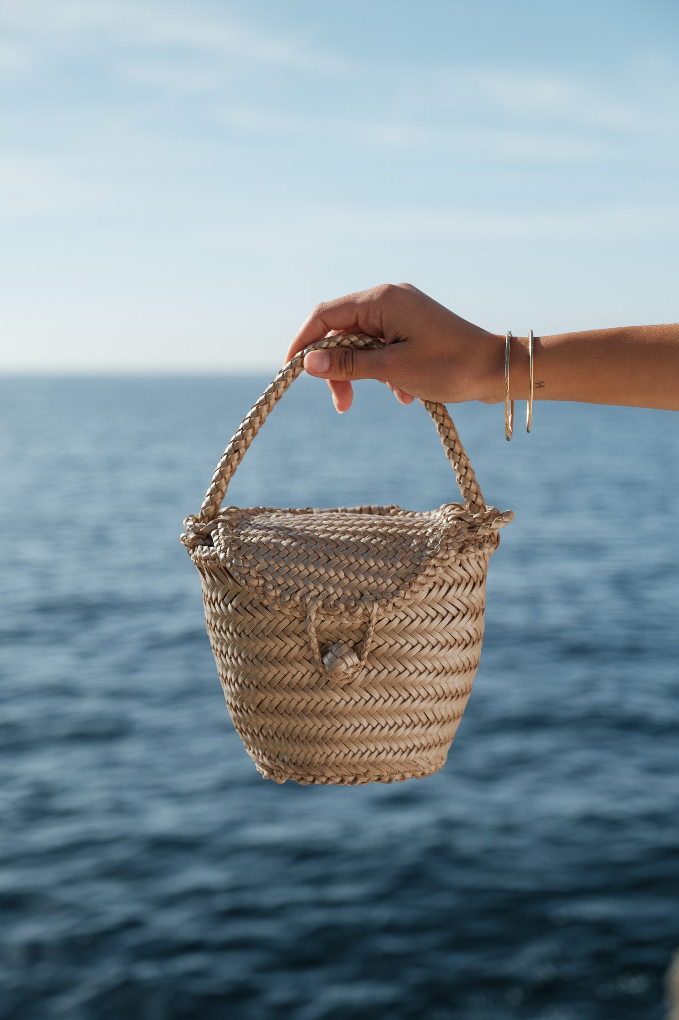 Jane Gold Woven Leather Wicker Basket Bag by Il Etait un Fil - vintage-inspired handbag with structured wicker base and gold leather weave. Available at House of Woven Stories.