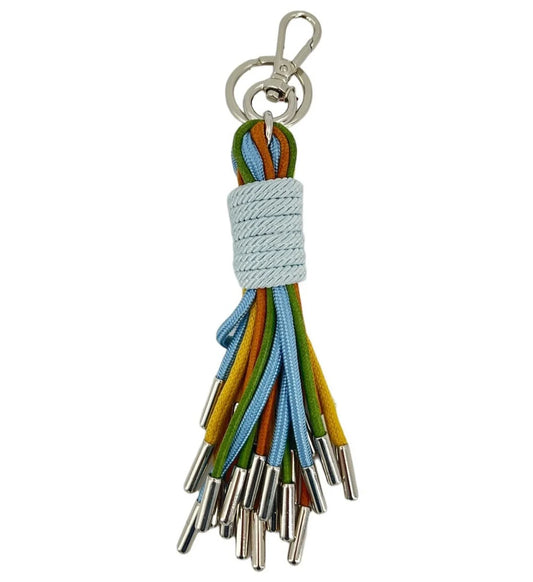 KWAST macramé key ring by MY BOB – handmade in Italy with flowing threads and rich textures, inspired by Flemish port town heritage. Elegant and artisanal accessory, packaged in a soft cotton bag. Shop now.
