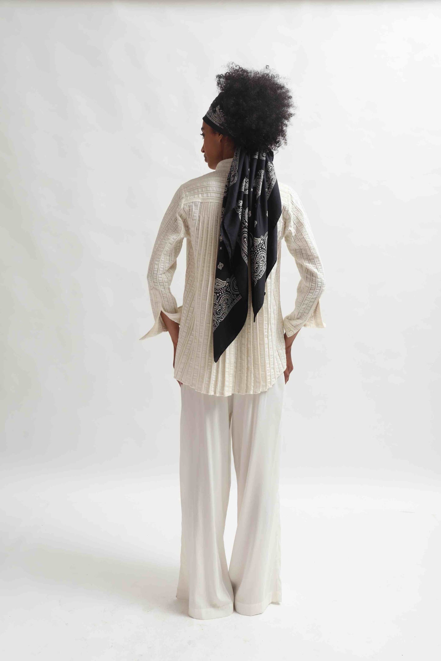 Leno Pleated Shirt by Paiwand made from upcycled cotton with breathable leno weave, featuring elegant pleats and handcrafted in India. Sustainable fashion curated by House of Woven Stories.
