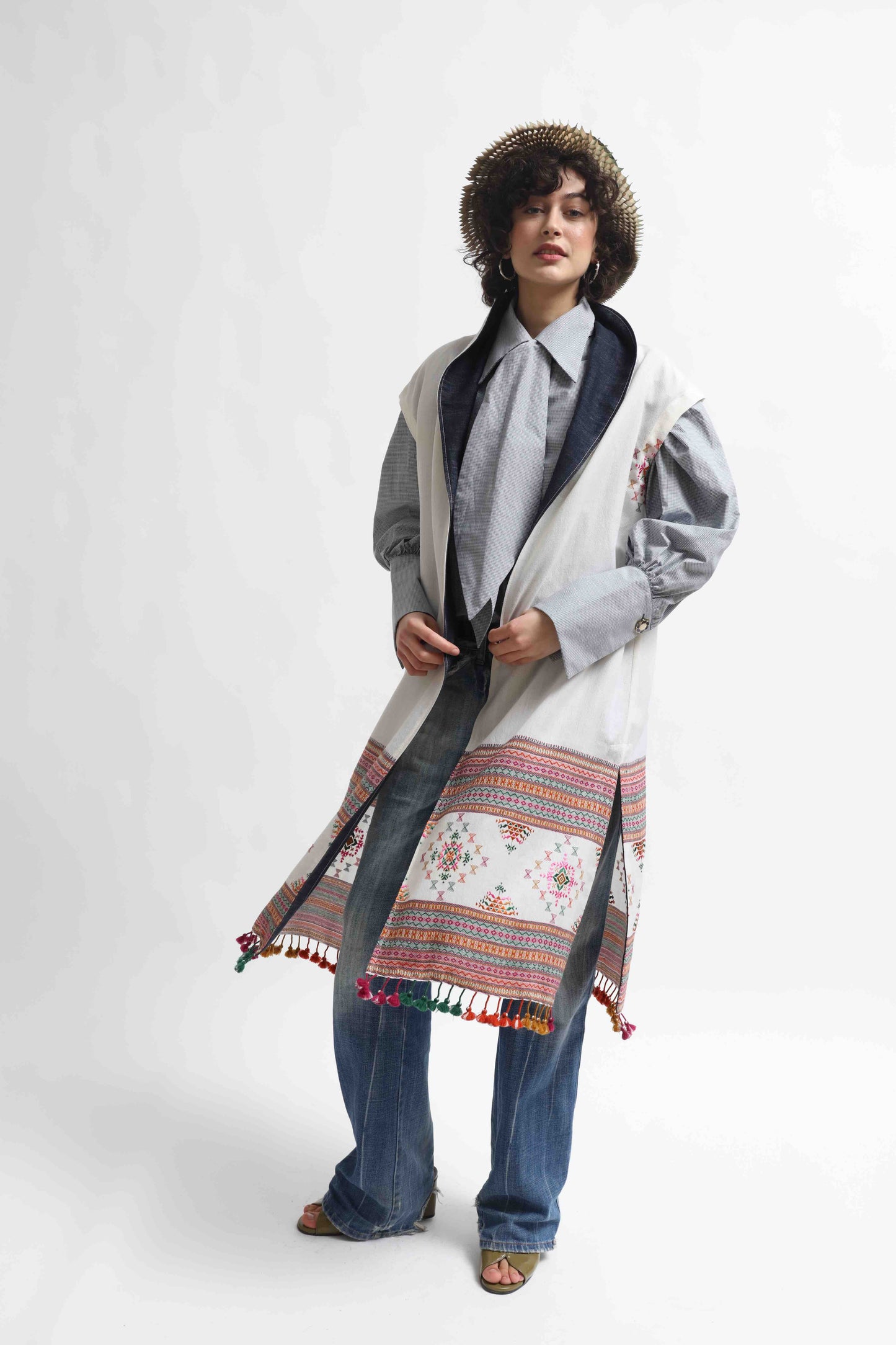 Blauj Gilet by House of Woven Stories – unique merino wool vest with colorful details and fringe hem, handcrafted in Italy using ethically sourced fabrics from India.