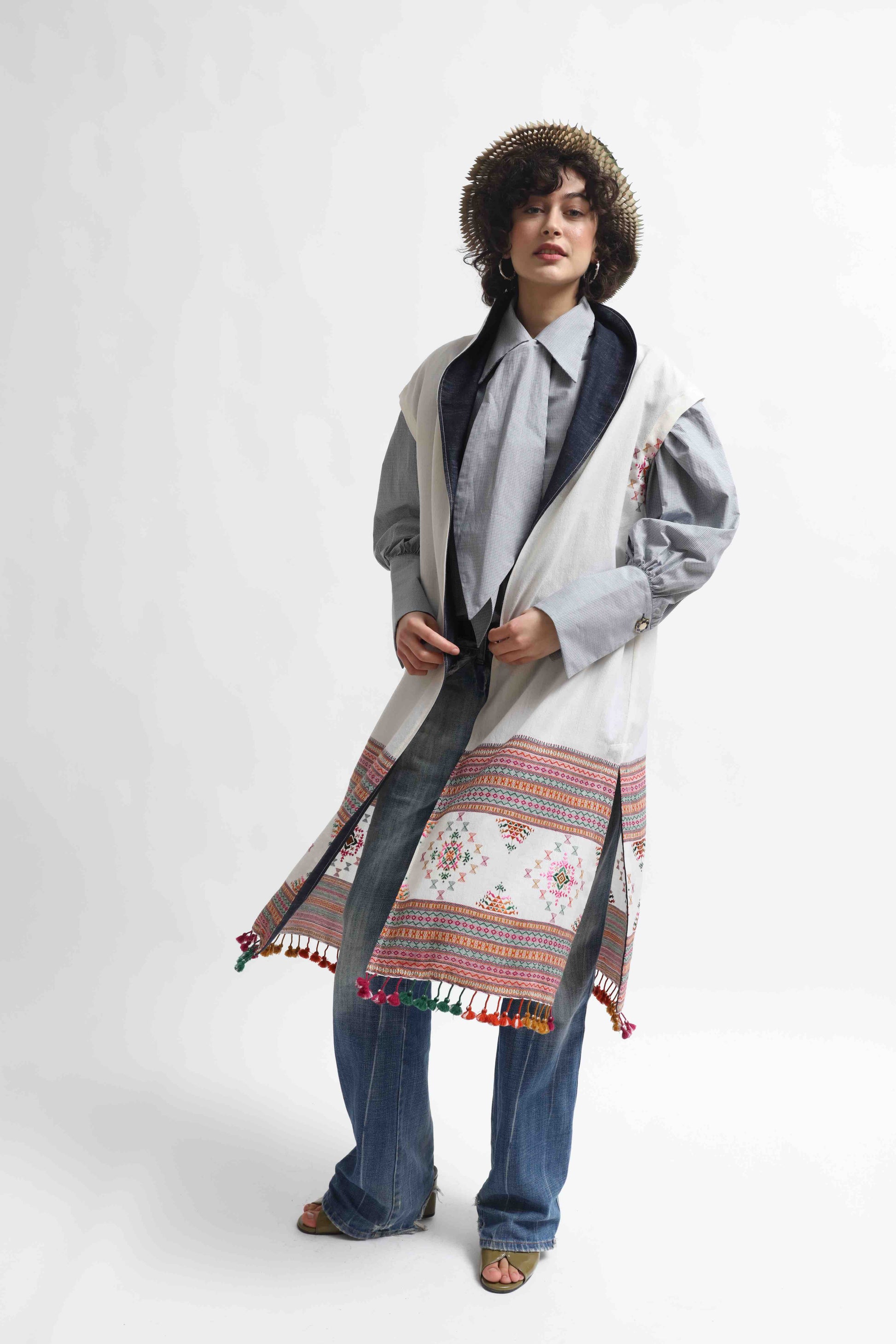 Blauj Gilet by House of Woven Stories – unique merino wool vest with colorful details and fringe hem, handcrafted in Italy using ethically sourced fabrics from India.