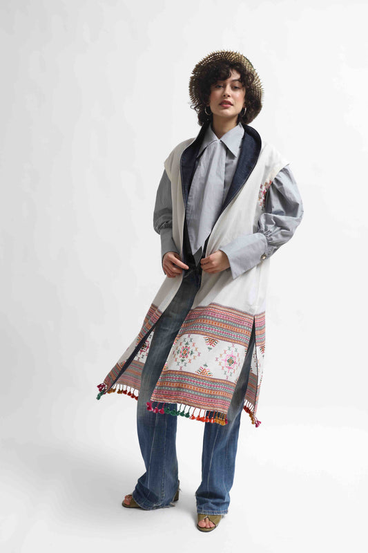 Blauj Gilet by House of Woven Stories – unique merino wool vest with colorful details and fringe hem, handcrafted in Italy using ethically sourced fabrics from India.
