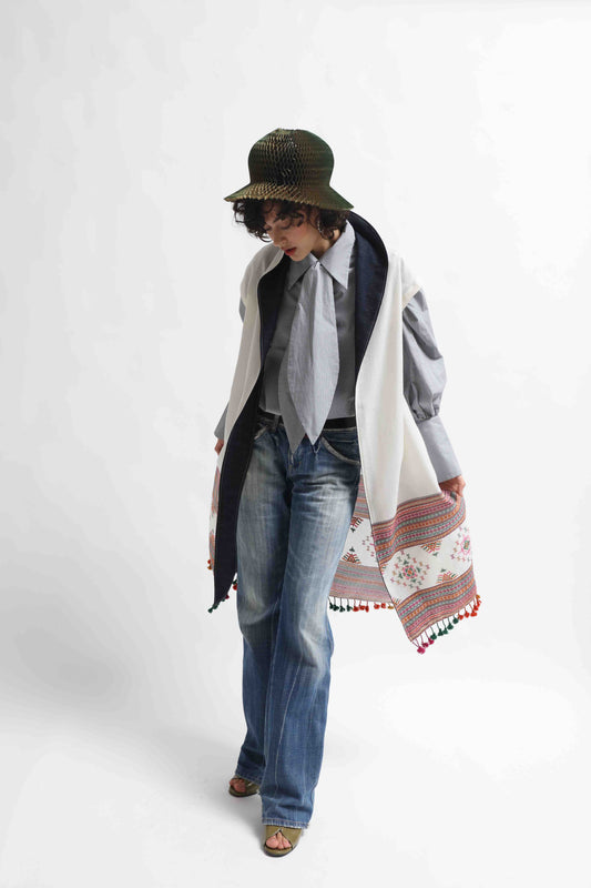 Blauj Gilet by House of Woven Stories – unique merino wool vest with colorful details and fringe hem, handcrafted in Italy using ethically sourced fabrics from India.
