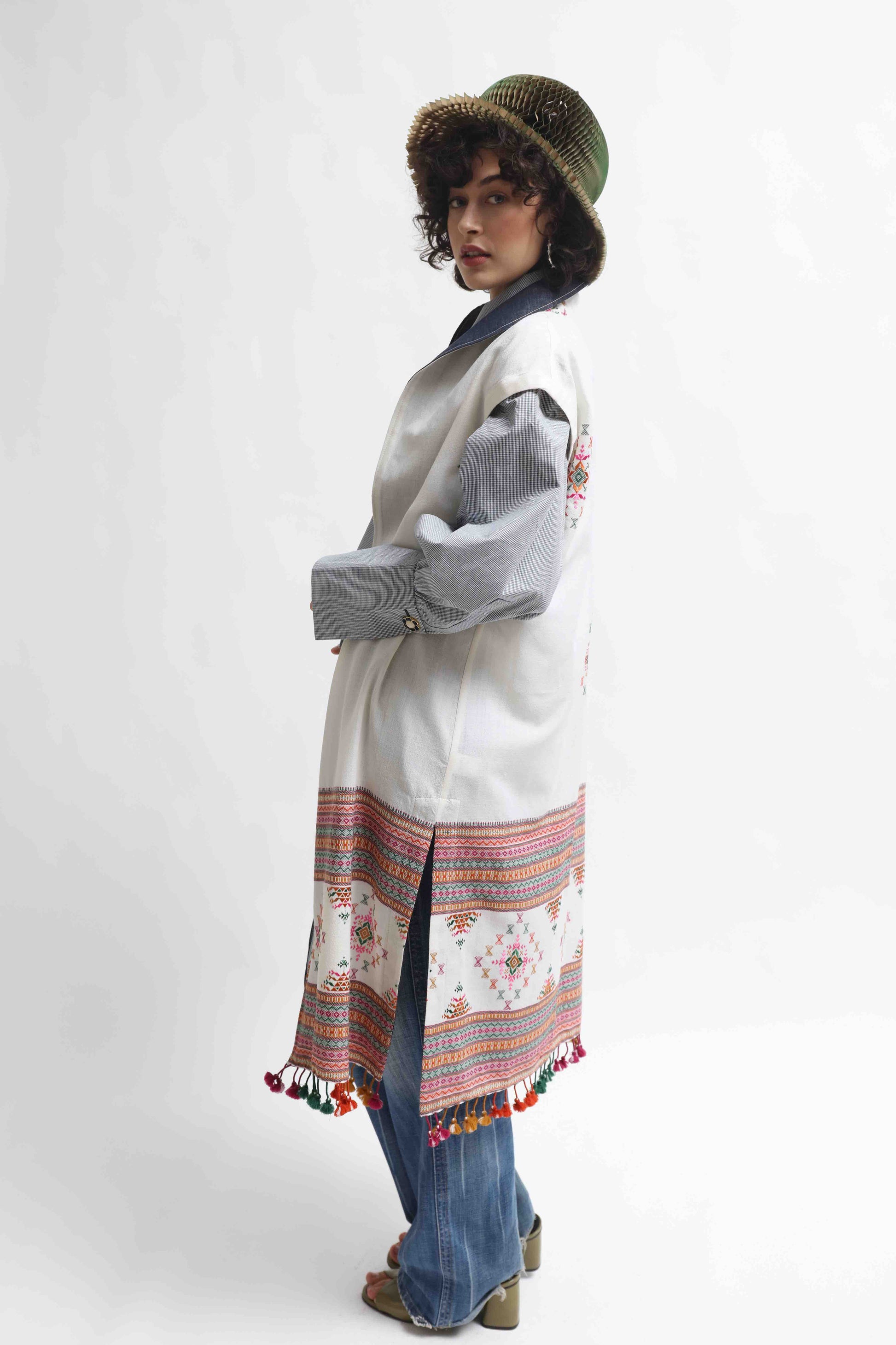 Blauj Gilet by House of Woven Stories – unique merino wool vest with colorful details and fringe hem, handcrafted in Italy using ethically sourced fabrics from India.