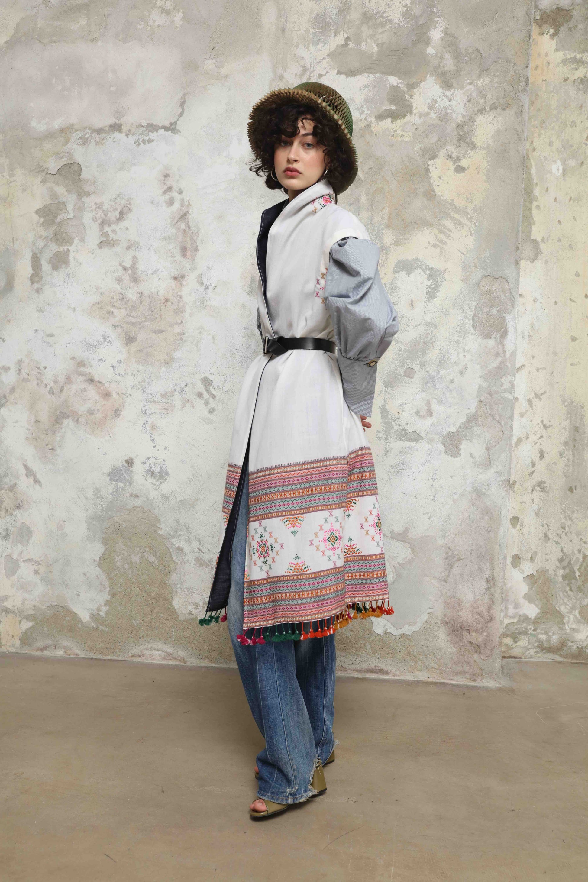 Blauj Gilet by House of Woven Stories – unique merino wool vest with colorful details and fringe hem, handcrafted in Italy using ethically sourced fabrics from India.