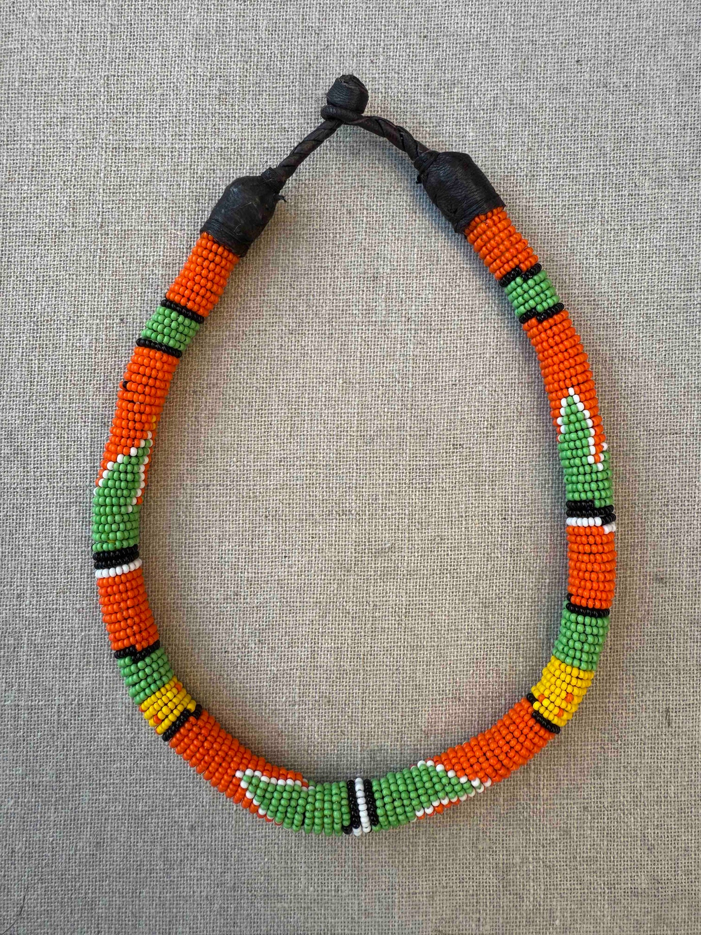 Multicolor beaded necklace handcrafted by Maasai women artisans in Kenya, featuring intricate glass beadwork. Curated by House of Woven Stories.
