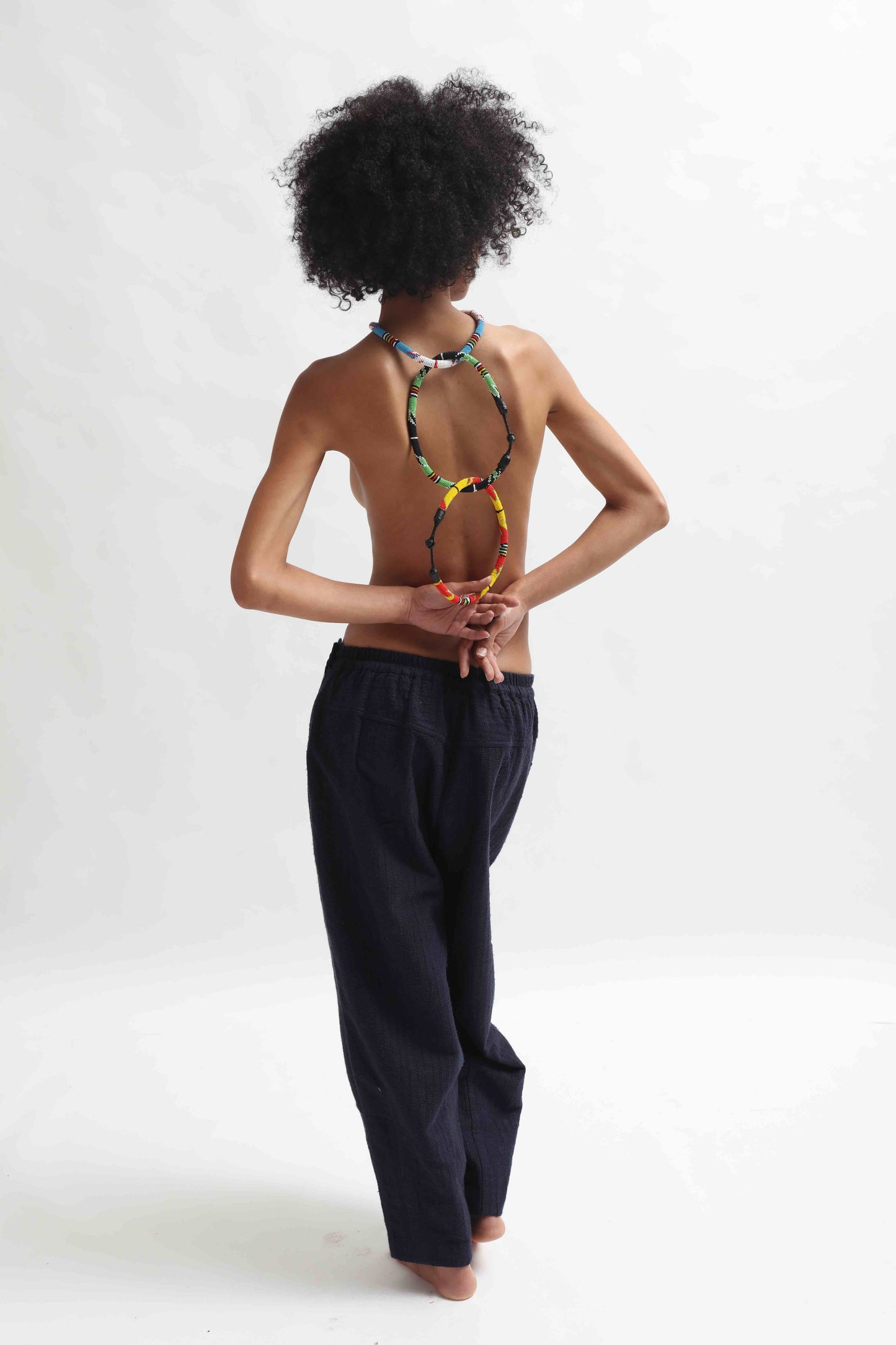 Multicolor beaded necklace handcrafted by Maasai women artisans in Kenya, featuring intricate glass beadwork. Curated by House of Woven Stories.