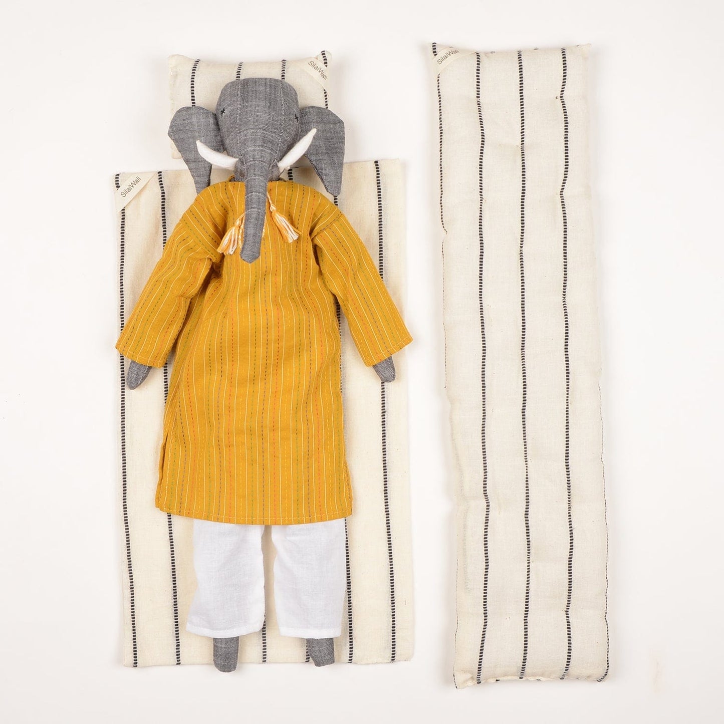 Handcrafted elephant cloth doll named Mumba by SilaiWali, made from upcycled fabric, featuring eco-friendly design. Available at House of Woven Stories