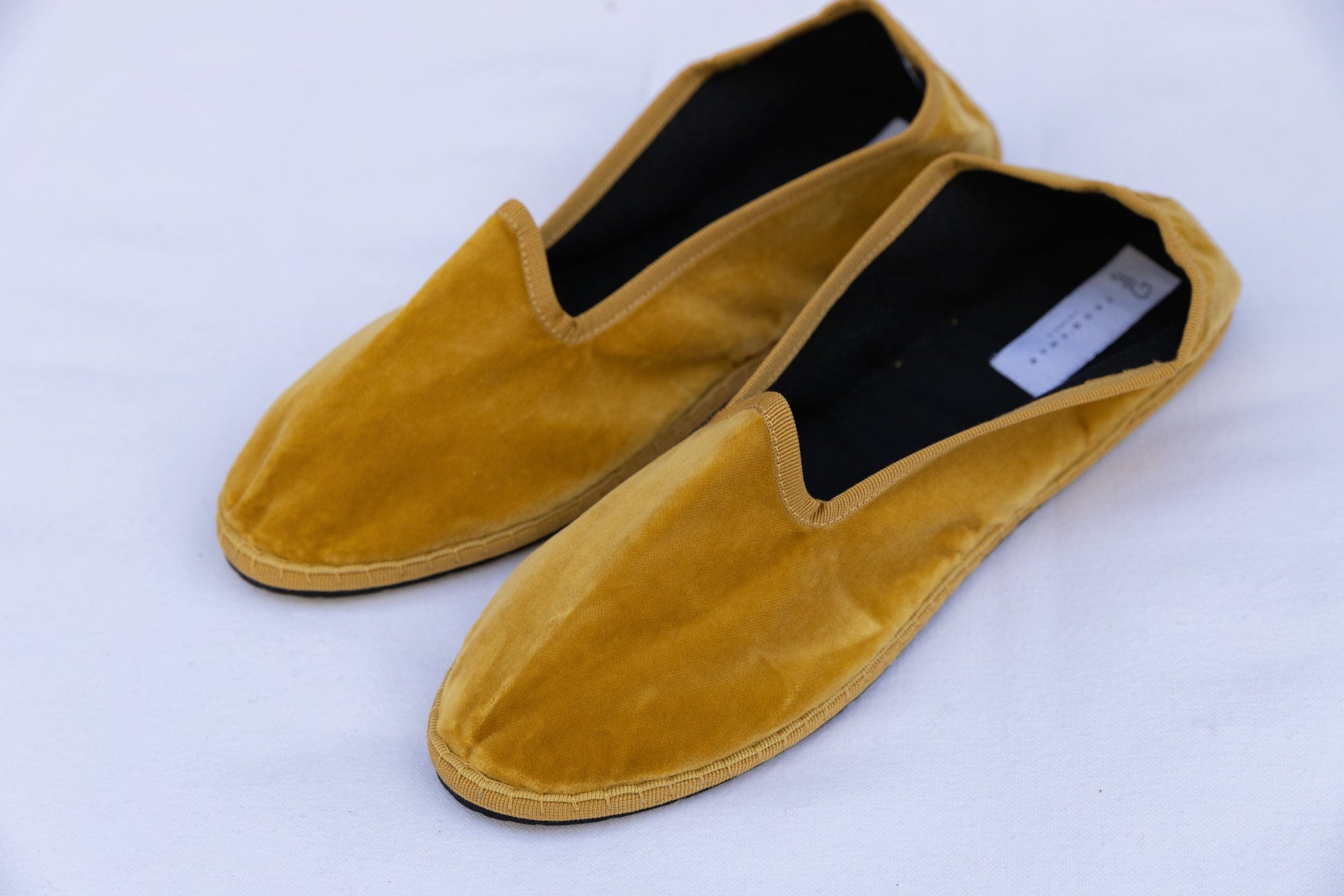 Mustard Venetian Slippers by Teod’amar, handmade in Venice from upcycled luxury fabrics with recycled rubber soles. Timeless, sustainable, and exclusive.