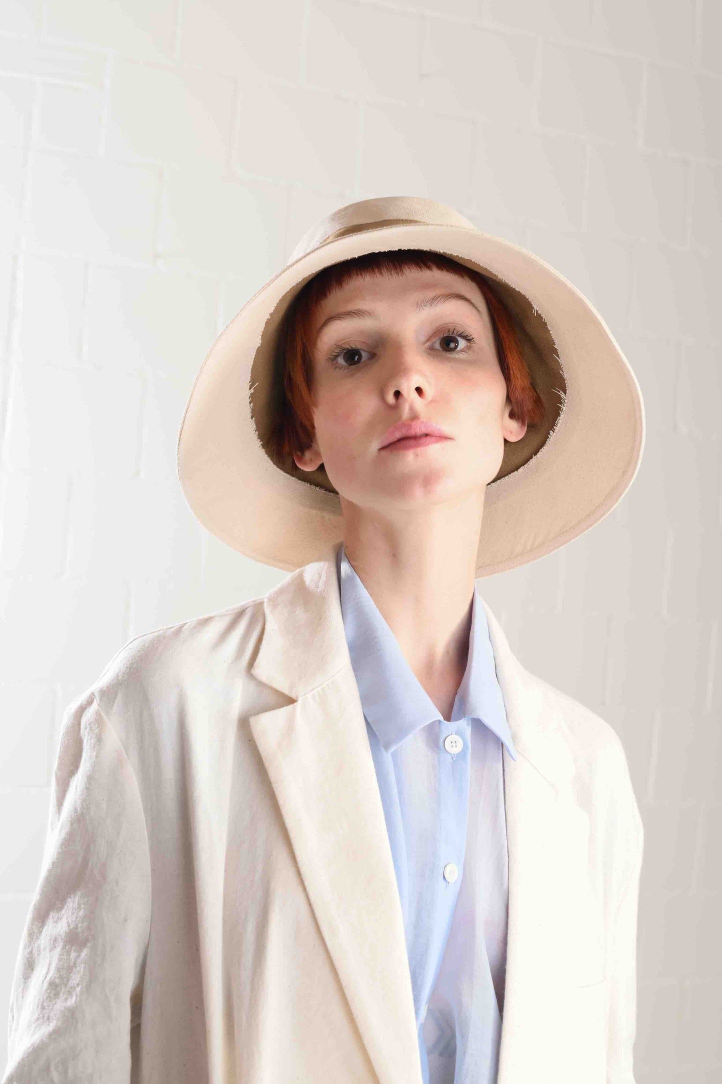 Medium-brimmed cotton fedora hat by Lola Hats, designed for travel and breezy weather, handcrafted in Brooklyn. Available at House of Woven Stories.