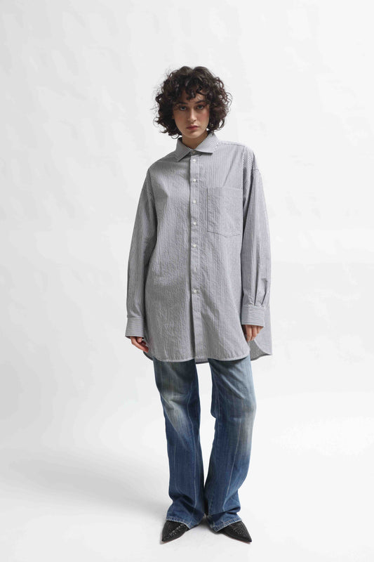 Crisp 100% organic cotton shirt with classic collar and marine blue and white stripes, handcrafted by House of Woven Stories in Italy’s Piedmont region, featuring a soft paper-touch finish and relaxed fit for versatile, refined style.