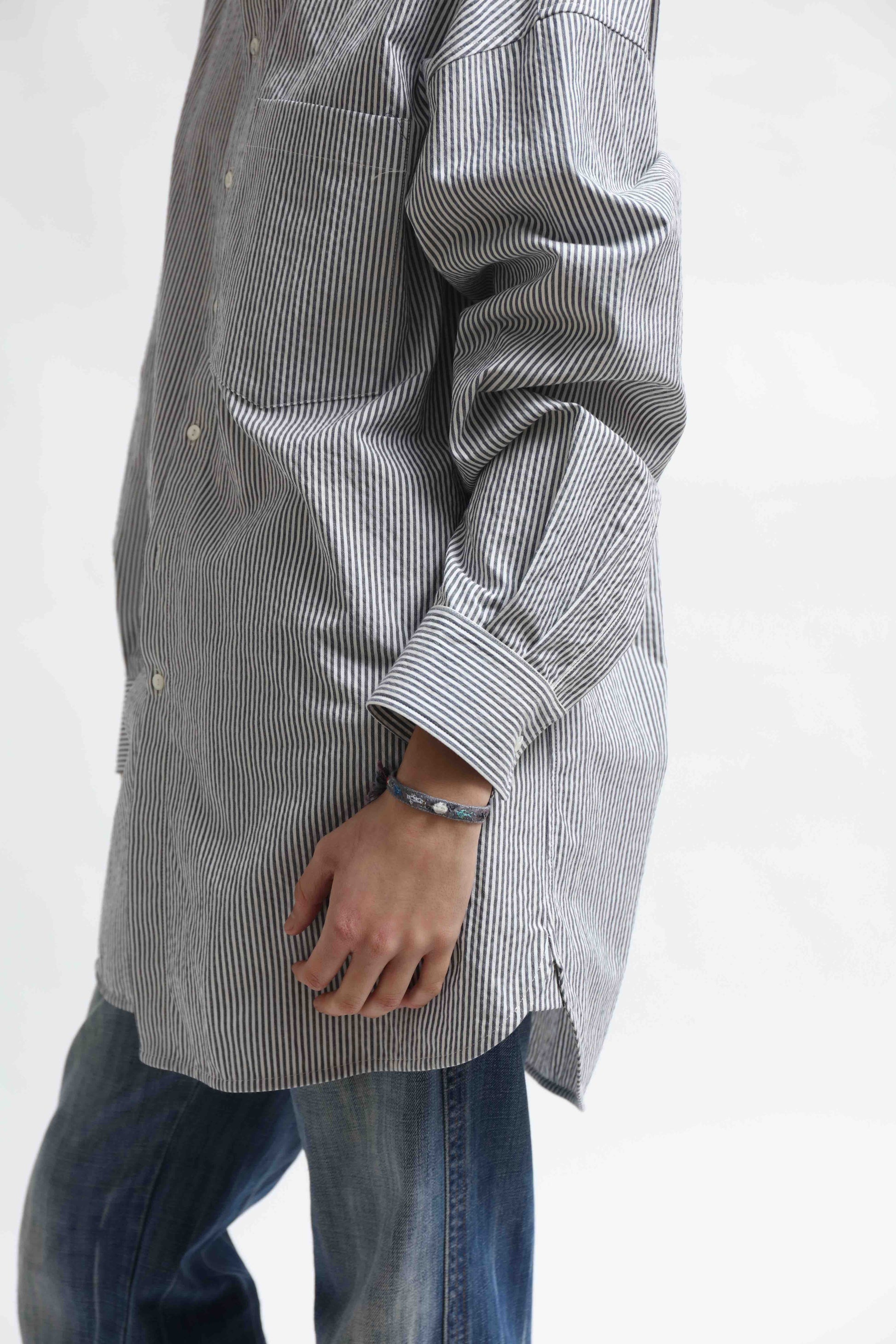 Crisp 100% organic cotton shirt with classic collar and marine blue and white stripes, handcrafted by House of Woven Stories in Italy’s Piedmont region, featuring a soft paper-touch finish and relaxed fit for versatile, refined style.