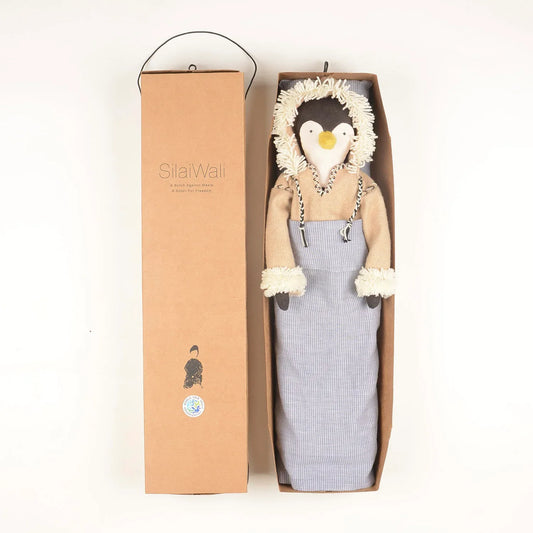 Handcrafted Patuk the Penguin soft toy made from upcycled fabric, created by Afghan refugee women artisans through SilaiWali, with bedding included in a foldable gift box.