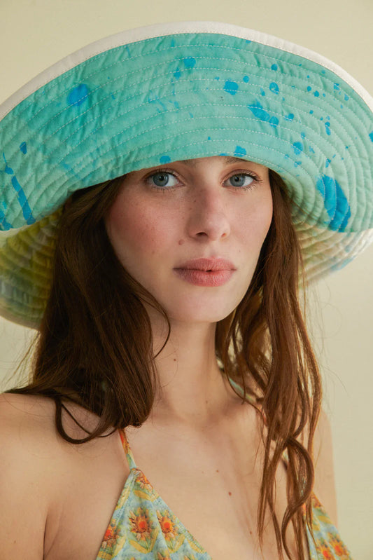 Reversible hand-painted hat by Romualda with a 12 cm brim, featuring vibrant brush strokes and cotton lining, made from sustainable materials.